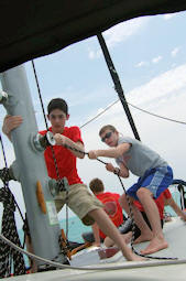 Boy Scouts hoisting sails at Florida Sea Base aboard the sailboat Stormalong